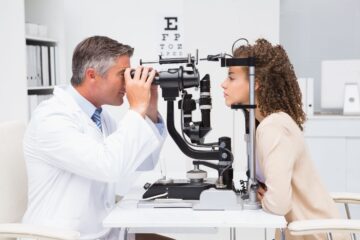 A close-up photograph of an eye undergoing an examination, highlighting the importance of regular vision care.